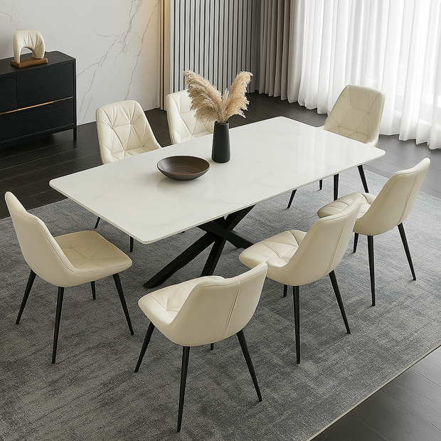 A Light Calacatta marble dining table with black metal cross base, accompanied by eight Gori White PU Leather upholstered chairs with metal legs.